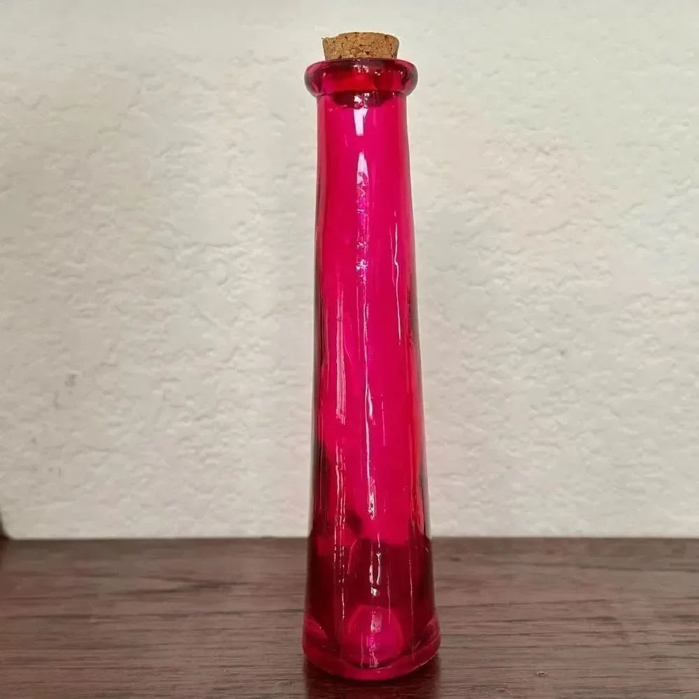 Vintage pink bottle with cork